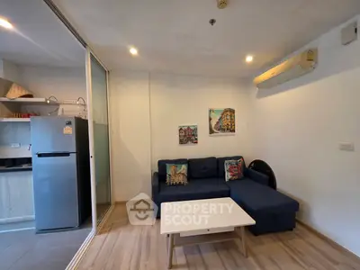 Cozy living room with modern kitchen and stylish decor