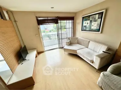 Cozy living room with modern decor and balcony view
