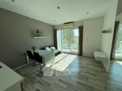 Bright modern living room with large windows and stylish decor