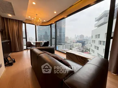 Luxurious corner unit living room with panoramic city view and elegant decor.