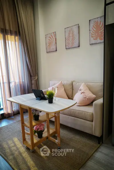 Cozy living room with elegant decor and natural light, perfect for relaxation and comfort.