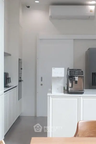 Modern kitchen with sleek appliances and minimalist design