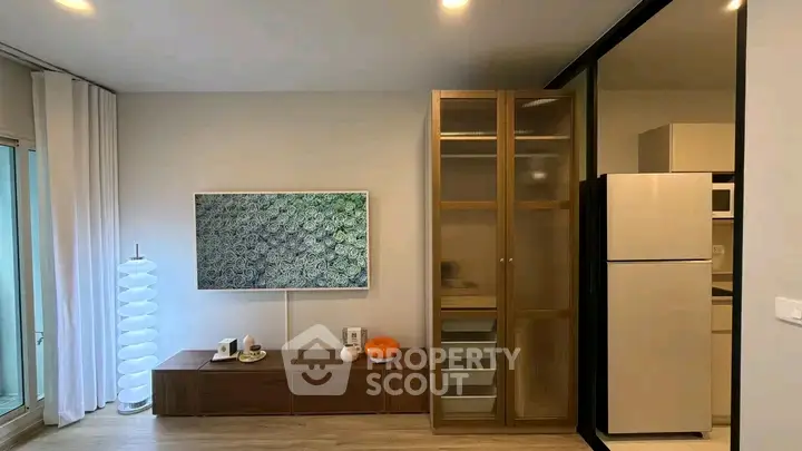 Modern living room with sleek furniture and stylish decor in a contemporary apartment.