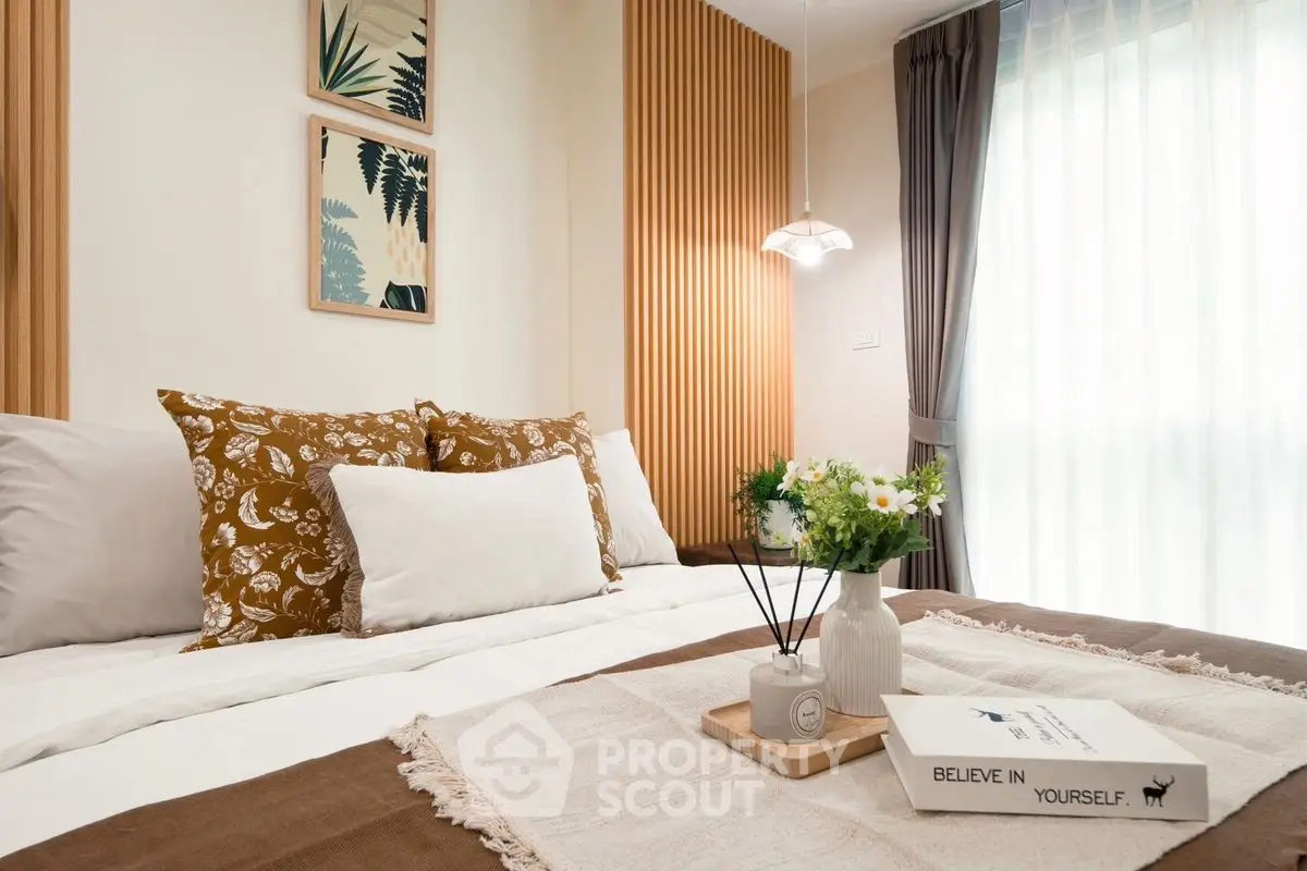 Cozy bedroom with stylish decor and natural light
