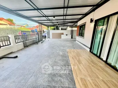 Spacious covered patio with modern design and ample natural light