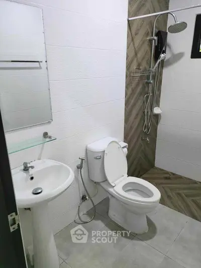 Modern bathroom with shower and toilet in sleek design