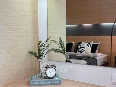 Stylish bedroom with modern decor and elegant design elements, featuring a cozy bed and chic accessories.
