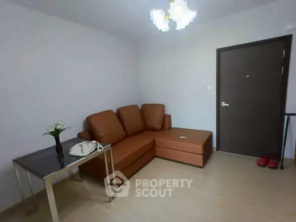 Cozy living room with brown leather sofa and modern decor