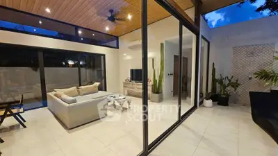Luxurious modern living room with floor-to-ceiling windows and elegant decor