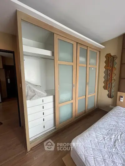 Spacious bedroom with built-in wardrobe and modern design