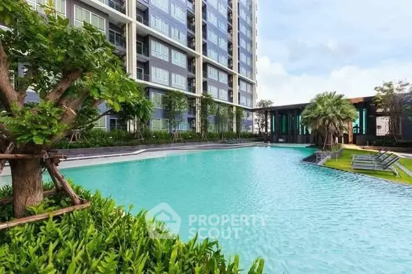 Luxurious condominium with stunning pool and lush greenery, perfect for modern living.
