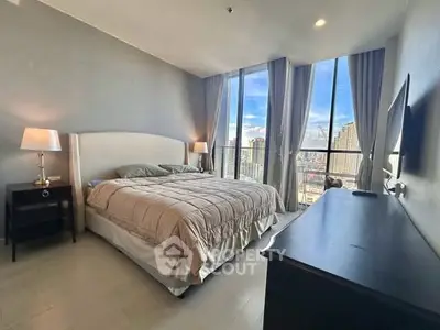 Luxurious bedroom with stunning city view and elegant decor