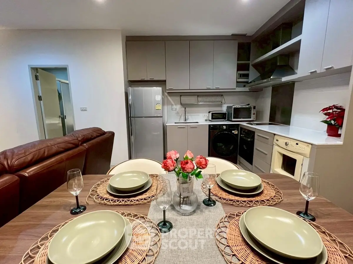 Modern kitchen and dining area with stylish decor and appliances