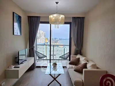 Modern living room with balcony view in high-rise apartment