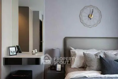 Modern bedroom with stylish decor and elegant wall clock