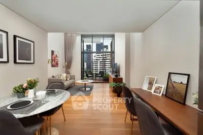 Modern living room with elegant decor and city view, featuring a cozy dining area and stylish furniture.