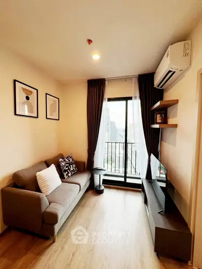 Modern living room with city view, stylish decor, and cozy ambiance.