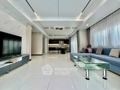 Spacious modern living room with sleek design and elegant furnishings