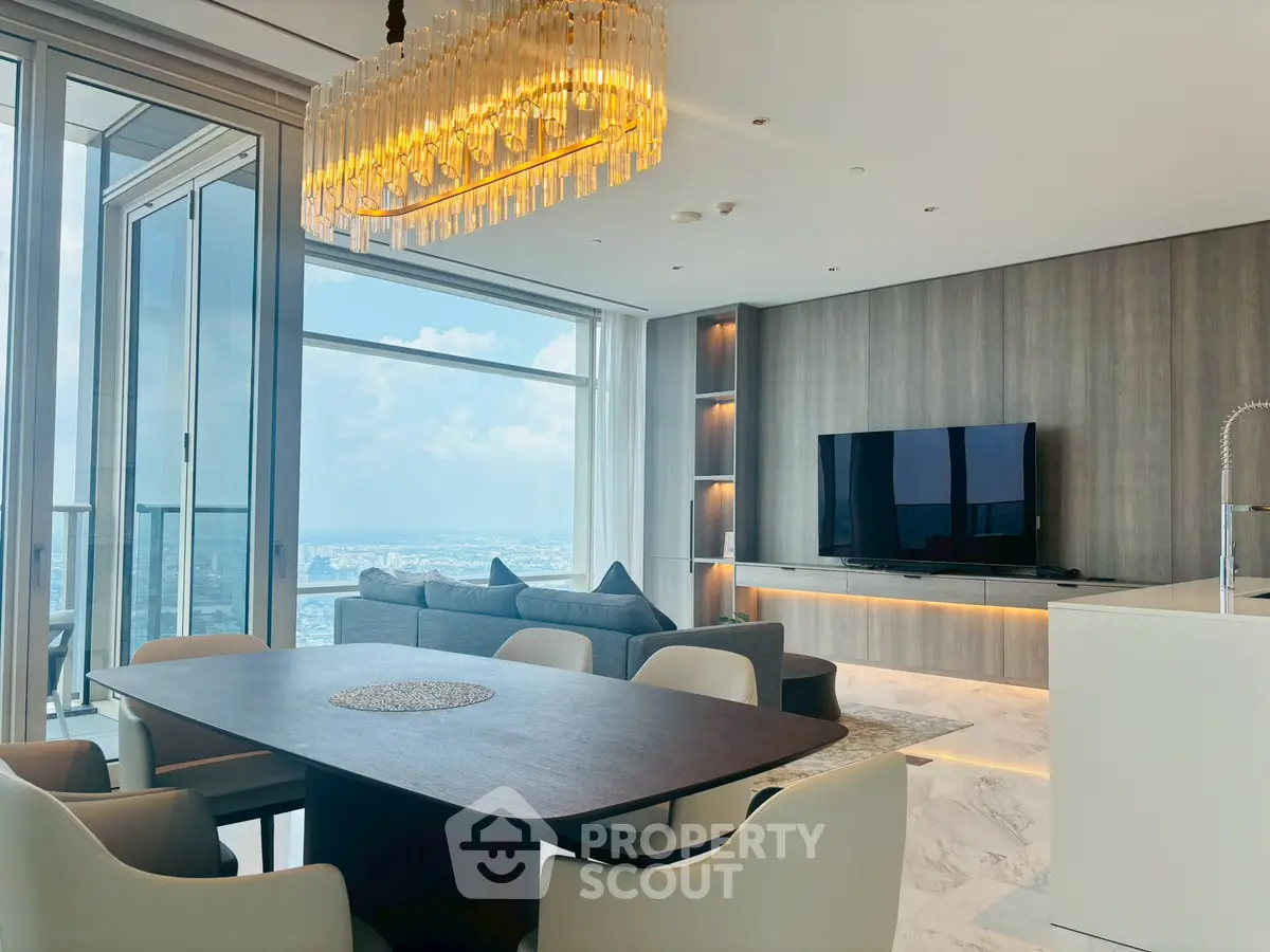 Luxurious modern living room with panoramic city view and elegant chandelier.