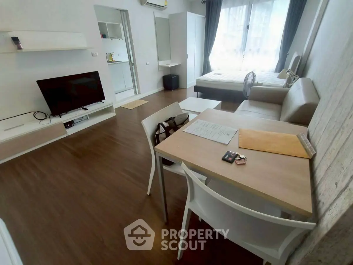 Modern studio apartment with open layout and stylish furnishings