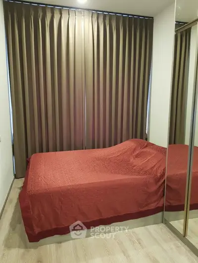 Cozy bedroom with elegant curtains and mirrored wardrobe