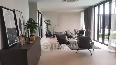 Spacious modern living room with elegant decor and large windows