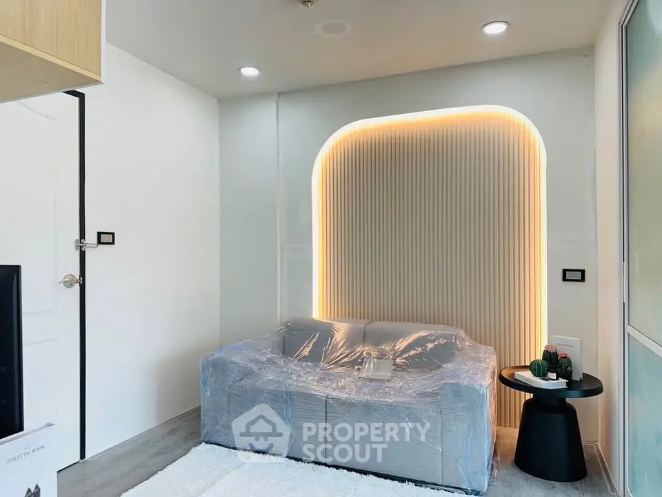 Modern living room with stylish lighting and cozy sofa