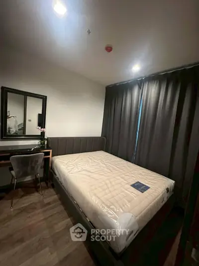 Cozy bedroom with modern furnishings and natural light