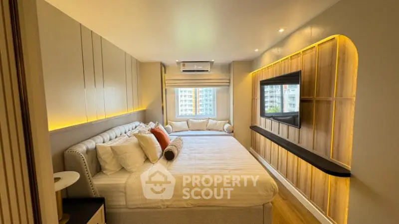 Luxurious modern bedroom with elegant lighting and large windows