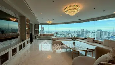 Luxurious living room with panoramic city views and elegant chandeliers
