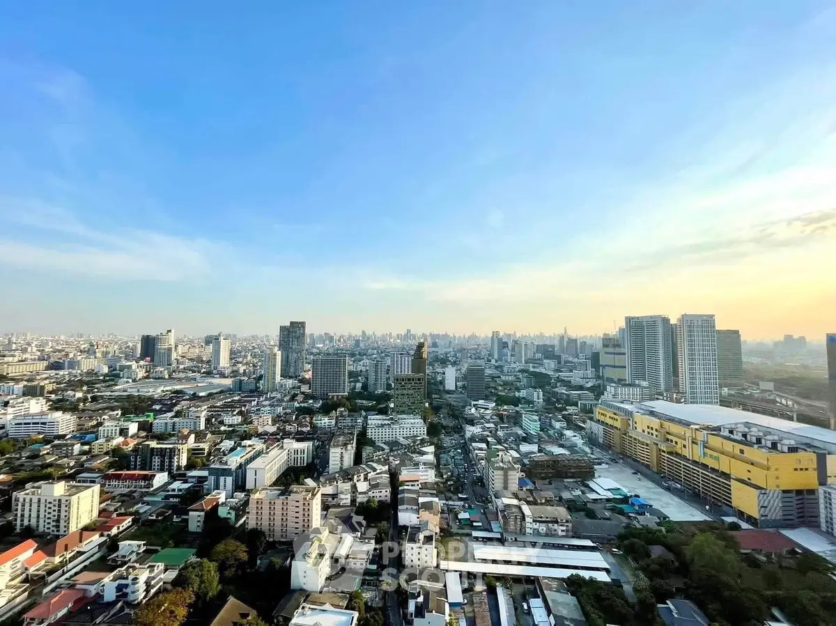 Stunning cityscape view from high-rise building showcasing urban skyline and vibrant city life.