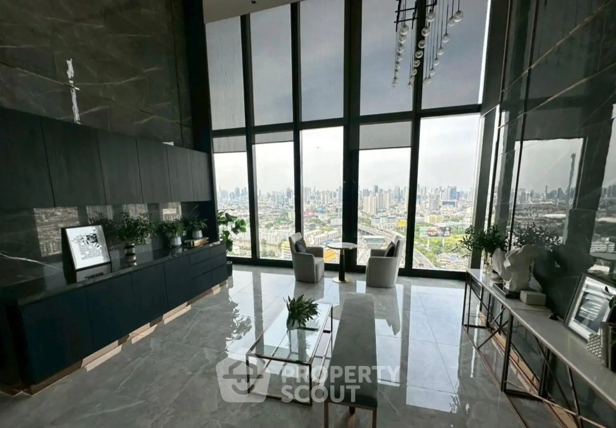 Luxurious high-rise living room with panoramic city views and elegant modern decor.