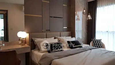 Luxurious bedroom with modern decor and ambient lighting in upscale apartment.