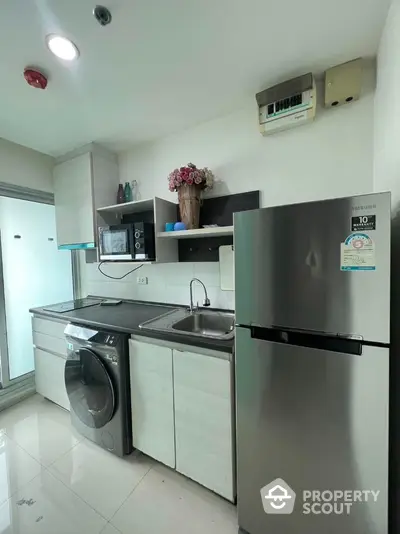 Modern kitchen with stainless steel appliances and sleek cabinetry