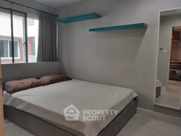 Cozy bedroom with modern design and ample natural light