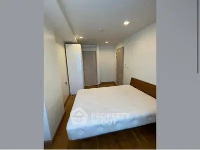 Cozy bedroom with modern design and ample natural light