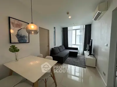 Modern living room with sleek furniture and natural light, perfect for urban living.