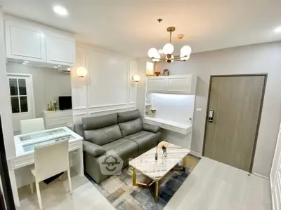 Modern living room with stylish decor and comfortable seating in a contemporary apartment.