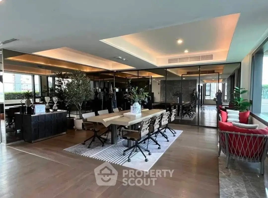 Luxurious open-plan living and dining area with modern decor and large windows.