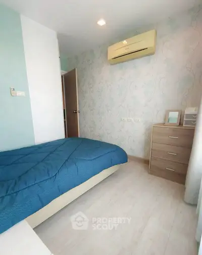 Cozy bedroom with modern decor and air conditioning unit