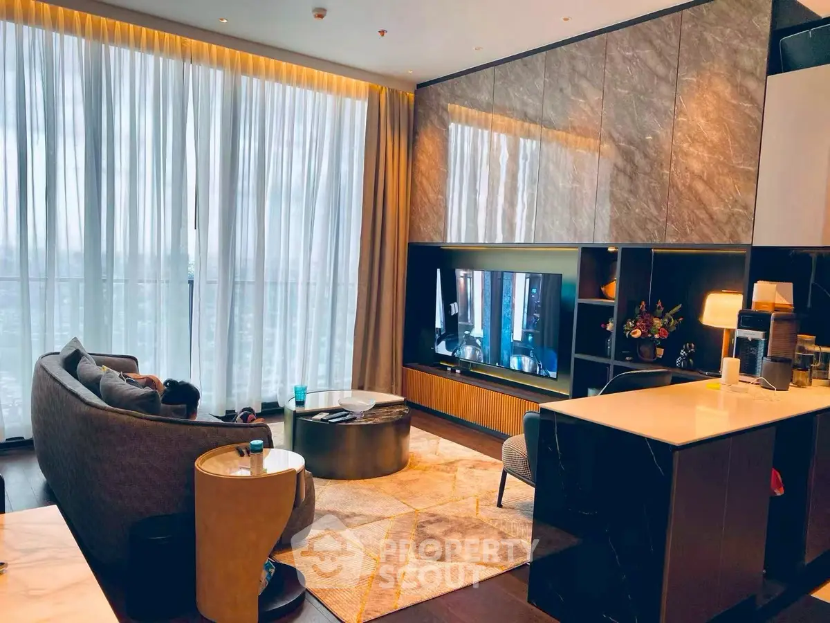 Luxurious modern living room with floor-to-ceiling windows and elegant decor.