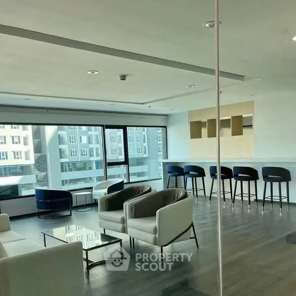 Modern living room with sleek furniture and city view, perfect for urban living.