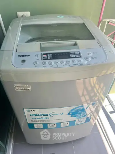 Modern washing machine on a balcony, perfect for urban apartments.