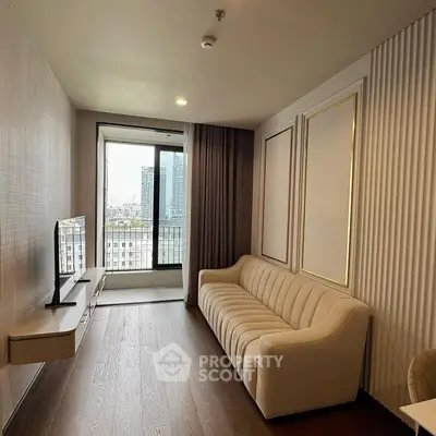 Modern living room with elegant sofa and city view from large window.