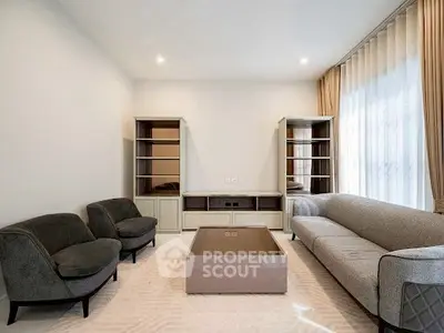 Spacious modern living room with elegant furniture and large windows