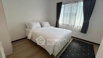 Cozy bedroom with natural light and modern decor