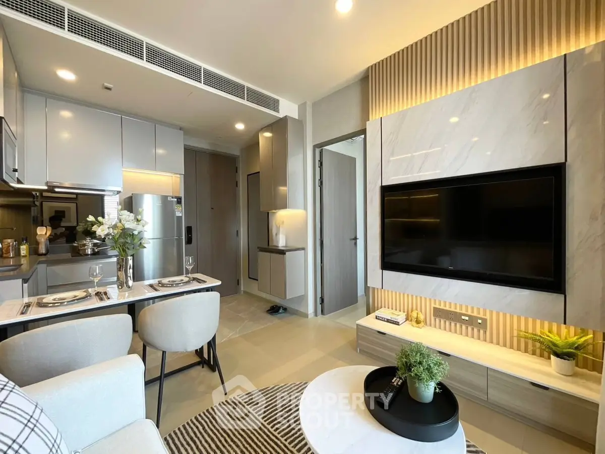 Modern living room with sleek design, open kitchen layout, and stylish decor
