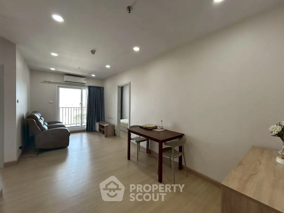 Spacious living room with modern furniture and natural light