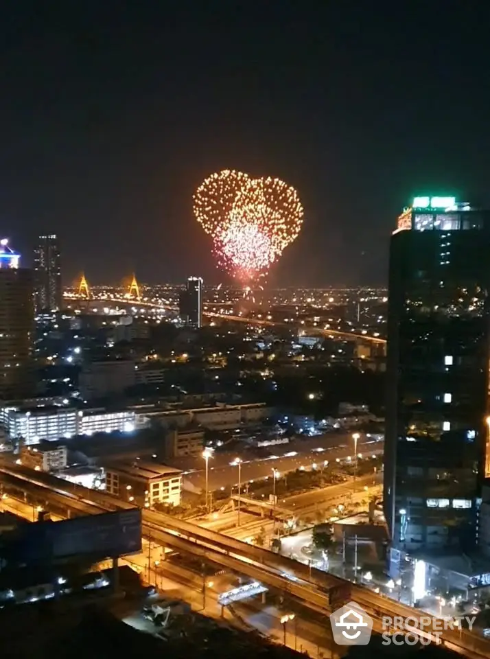 Stunning cityscape view with heart-shaped fireworks illuminating the night sky, perfect for urban living enthusiasts.