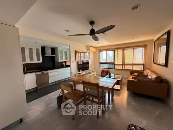 Spacious open-layout living room with modern kitchen and dining area